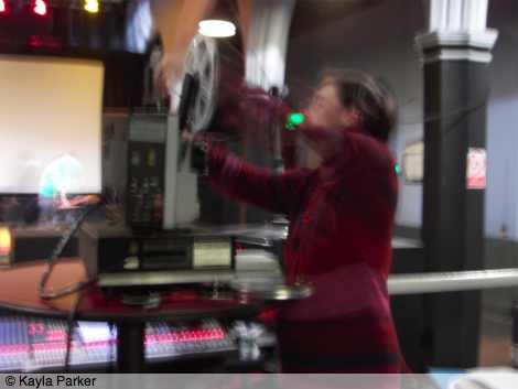 Kay's photo of Milena Gierke lacing up the giant Super 8 super projector brought over from Belgium, at Norwich Arts Centre on the last day of Aurora 2009