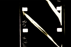 Digital photo of 16mm film frame, before cropping and colour harmonisation