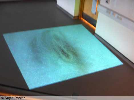 Photo of Immersion exhibiton at University of Plymouth: frame of White Body projected onto the gallery floor